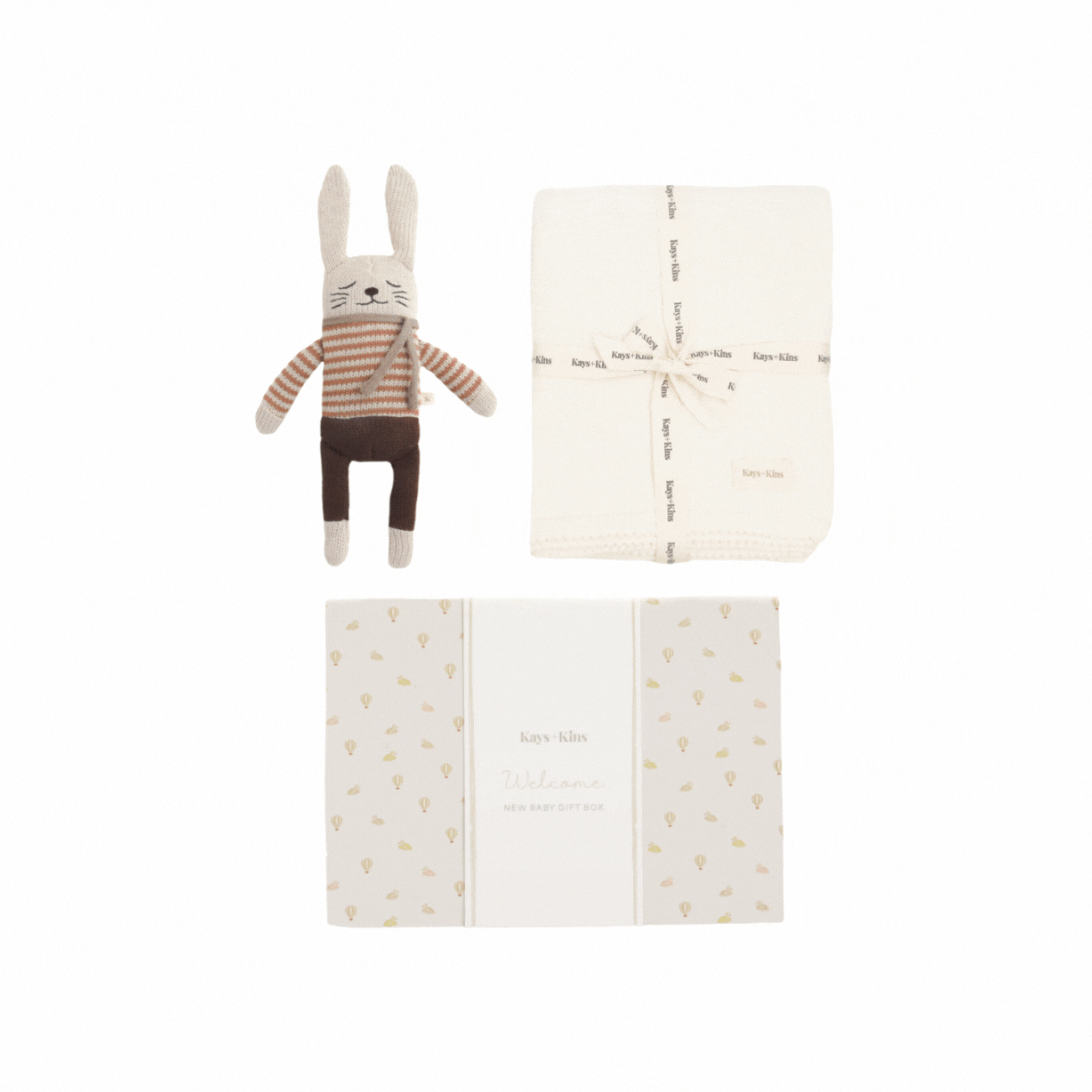 What_s_Inside_A_beautifully_soft_knit_blanket_ideal_for_cozy_snuggles_and_lasting_memories._An_adorable_heirloom-quality_bunny_toy_hand-knit_for_your_little_one_to_cherish._Each_item.gif
